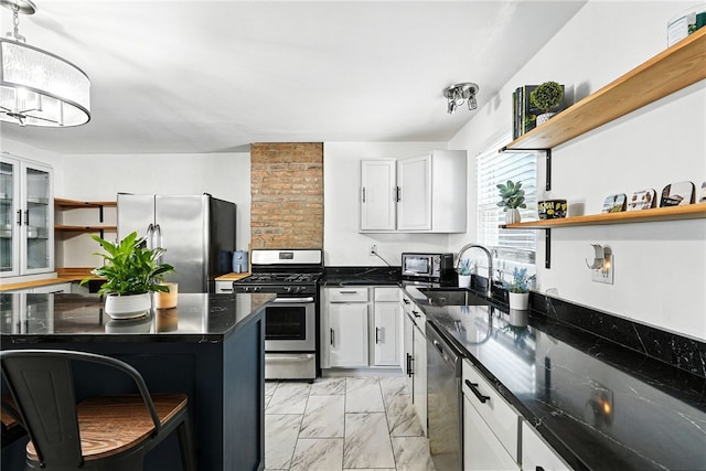 2740 Shelly St, South Side, PA 15203 - kitchen with open shelves, appliances with stainless steel finishes, light marble finish flooring, and white cabinets