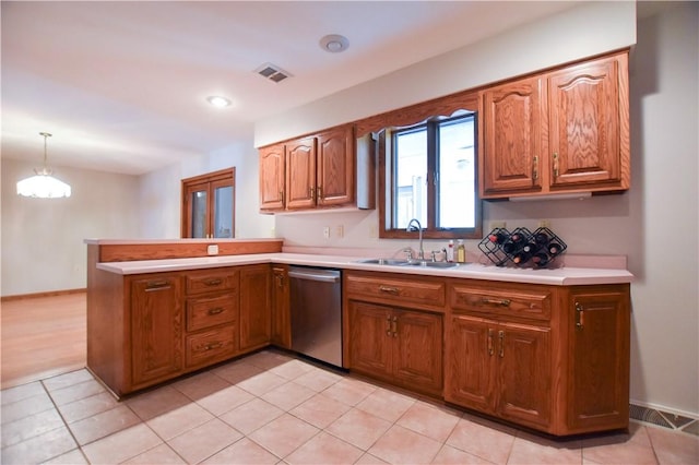 150 Morgan Rd, Penn Twp But, PA 16002 - kitchen with dishwasher, light countertops, a peninsula, brown cabinets, and recessed lighting