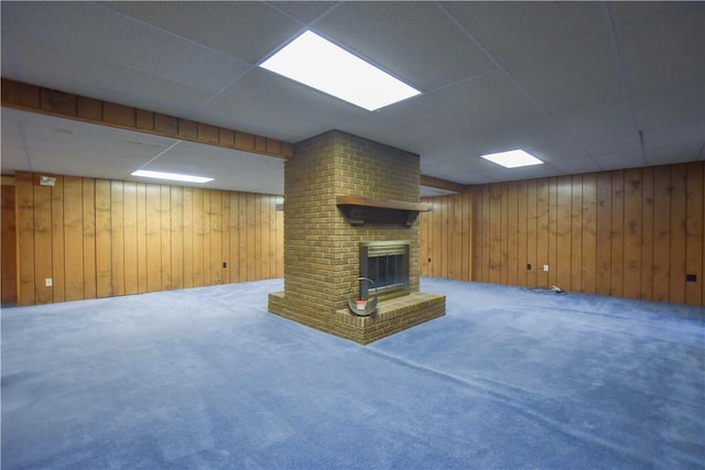 150 Morgan Rd, Penn Twp But, PA 16002 - finished below grade area featuring a paneled ceiling, carpet flooring, wood walls, and a brick fireplace