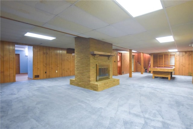 150 Morgan Rd, Penn Twp But, PA 16002 - finished below grade area featuring wooden walls, carpet, billiards, a brick fireplace, and a drop ceiling