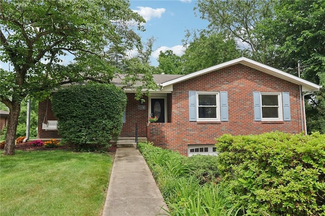 1154 Bucknell, Monroeville, PA 15146 - view of front facade featuring brick siding, a front yard, and an attached garage