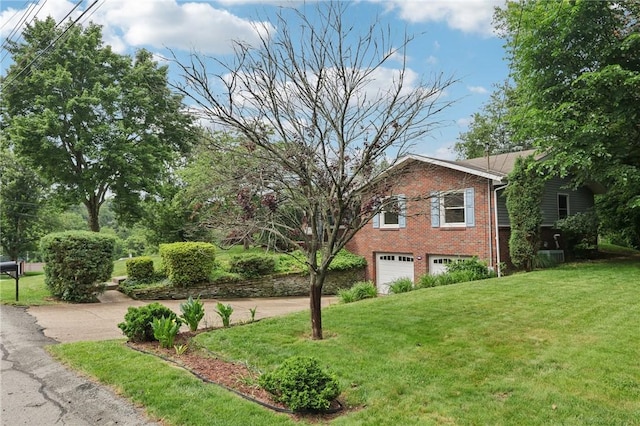 1154 Bucknell, Monroeville, PA 15146 - view of home's exterior featuring brick siding, an attached garage, a lawn, and driveway