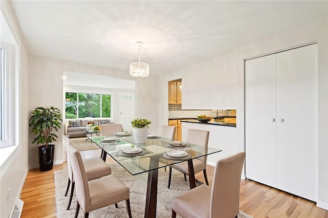 1154 Bucknell, Monroeville, PA 15146 - dining room featuring light wood-style flooring and a chandelier