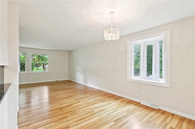 1154 Bucknell, Monroeville, PA 15146 - unfurnished dining area featuring light wood-style floors and a chandelier
