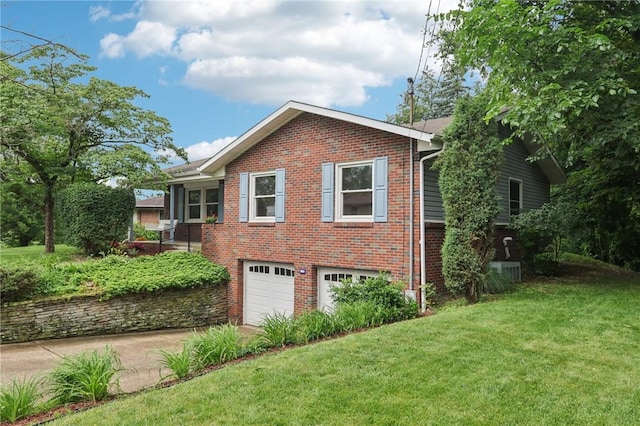 1154 Bucknell, Monroeville, PA 15146 - view of home's exterior with driveway, brick siding, an attached garage, and a lawn