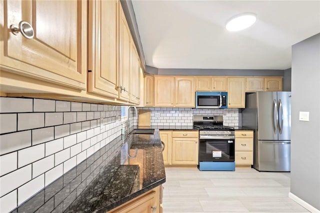 1154 Bucknell, Monroeville, PA 15146 - kitchen with stainless steel appliances, light brown cabinets, tasteful backsplash, and dark stone counters