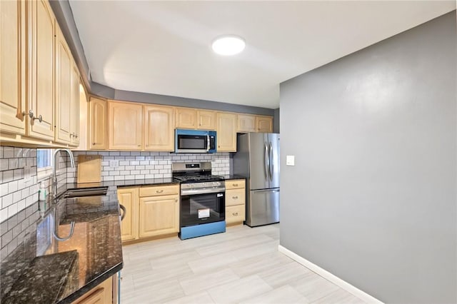 1154 Bucknell, Monroeville, PA 15146 - kitchen featuring stainless steel appliances, light brown cabinetry, backsplash, and dark stone counters