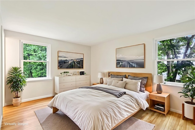 1154 Bucknell, Monroeville, PA 15146 - bedroom featuring multiple windows and wood finished floors