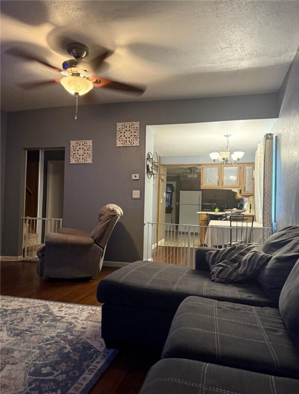 1930 Morris St, Shenango Twp Law, PA 16102 - living area with a chandelier, wood finished floors, and ceiling fan