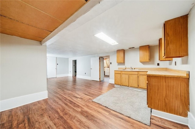520 Judith Dr, Baldwin Boro, PA 15236 - kitchen featuring light countertops, light wood-type flooring, and open floor plan