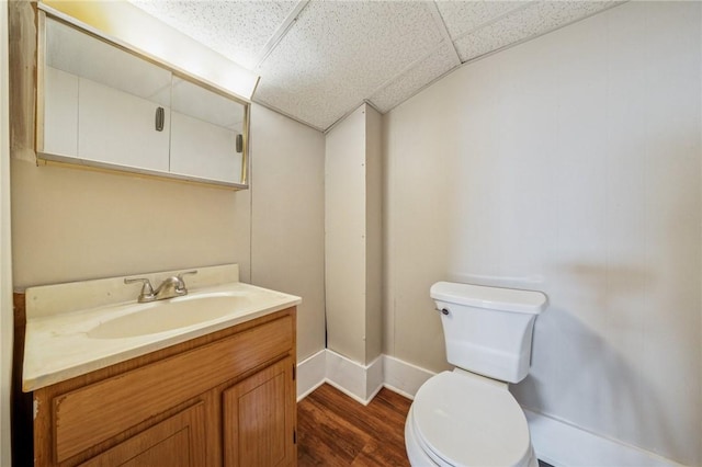 520 Judith Dr, Baldwin Boro, PA 15236 - half bath with vanity, wood finished floors, and a drop ceiling