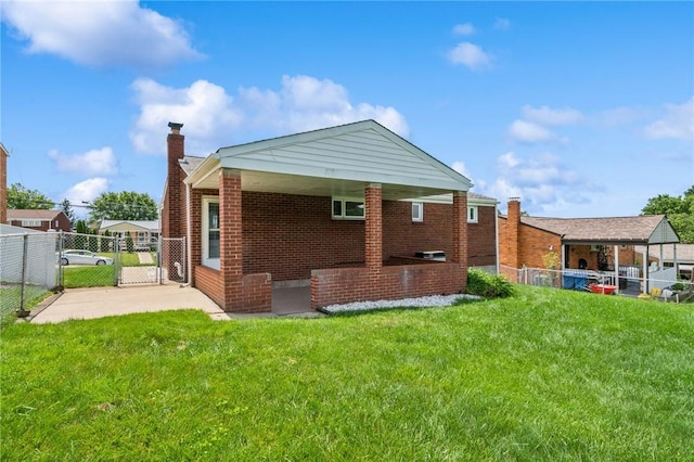 520 Judith Dr, Baldwin Boro, PA 15236 - rear view of house with a gate, brick siding, and a chimney