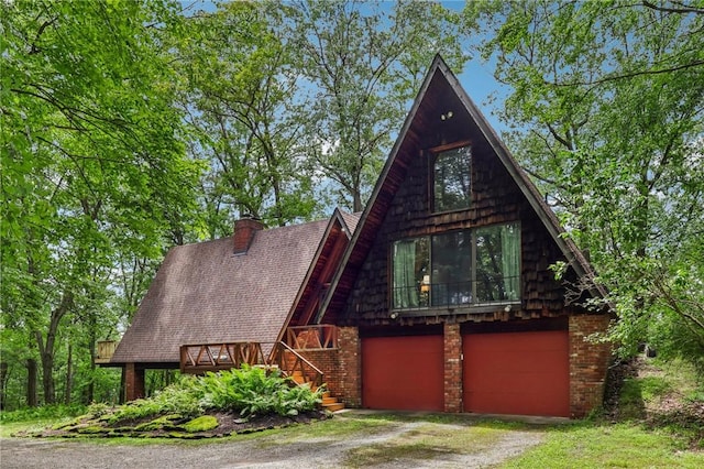 890 Pearce Mill Rd, Pine Twp Nal, PA 15090 - a-frame home featuring dirt driveway, stairway, brick siding, and an attached garage