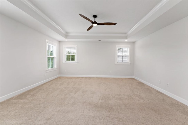 107 Abigail Dr, Adams Twp, PA 16046 - empty room featuring a raised ceiling, light colored carpet, ceiling fan, and crown molding