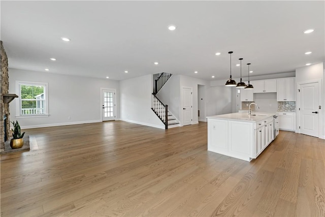107 Abigail Dr, Adams Twp, PA 16046 - kitchen featuring open floor plan, light countertops, white cabinetry, recessed lighting, and light wood-type flooring