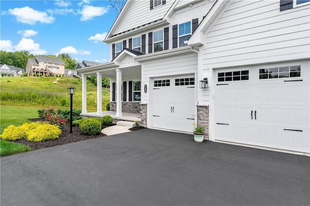 107 Abigail Dr, Adams Twp, PA 16046 - view of property exterior with covered porch, driveway, and an attached garage