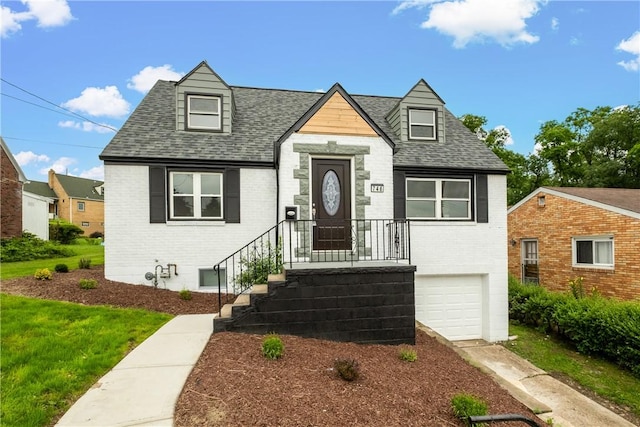 746 Agnew Rd, Baldwin Boro, PA 15227 - view of front facade with brick siding, a garage, and roof with shingles