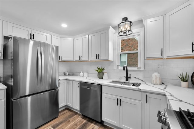 746 Agnew Rd, Baldwin Boro, PA 15227 - kitchen with stainless steel appliances, tasteful backsplash, a chandelier, white cabinets, and light stone counters
