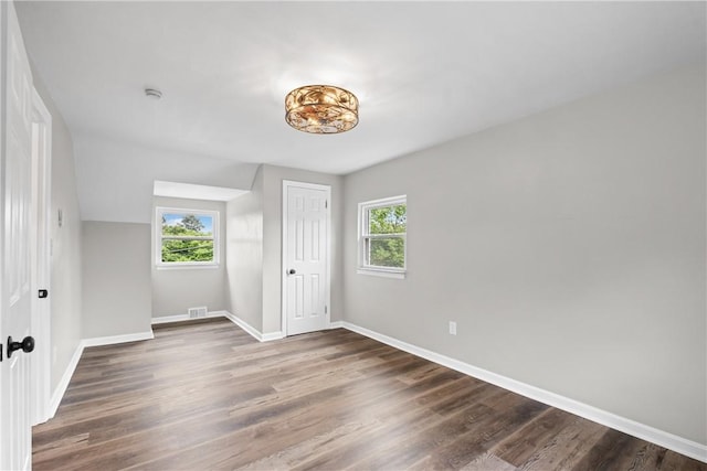 746 Agnew Rd, Baldwin Boro, PA 15227 - unfurnished bedroom featuring multiple windows, wood finished floors, and a closet