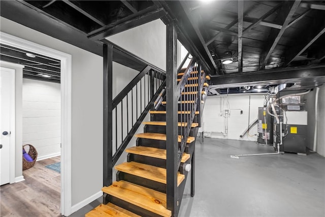 746 Agnew Rd, Baldwin Boro, PA 15227 - below grade area featuring stairs, gas water heater, heating unit, and concrete block wall