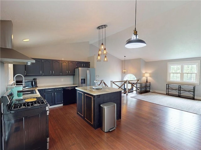 109 Remil Dr, Twp Of But Se, PA 16001 - kitchen with island range hood, stainless steel appliances, vaulted ceiling, light countertops, and dark wood-type flooring