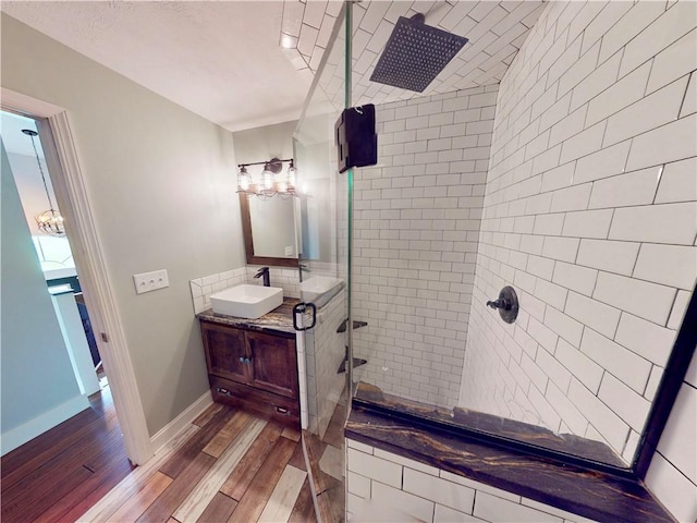 109 Remil Dr, Twp Of But Se, PA 16001 - bathroom with a tile shower, vanity, and wood finished floors