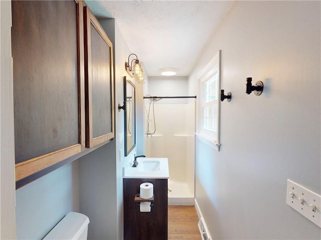 109 Remil Dr, Twp Of But Se, PA 16001 - full bathroom featuring a shower, wood finished floors, and vanity