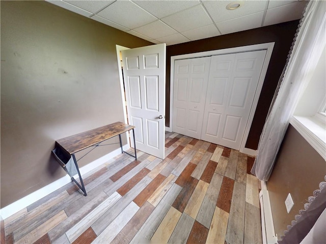 109 Remil Dr, Twp Of But Se, PA 16001 - hallway featuring a paneled ceiling, light wood finished floors, and baseboard heating