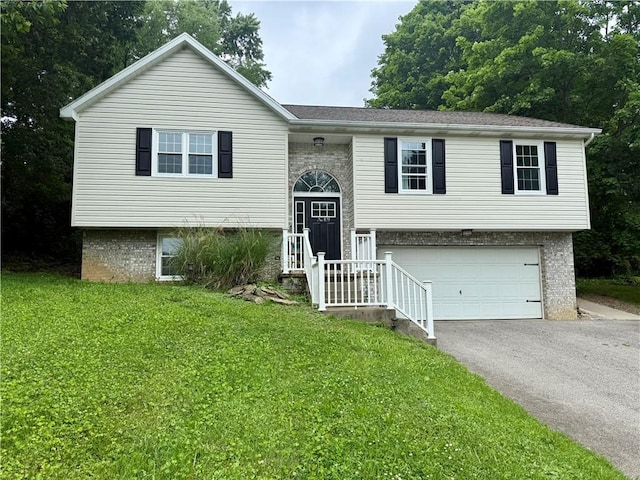 109 Remil Dr, Twp Of But Se, PA 16001 - bi-level home featuring driveway, a garage, a front yard, and brick siding