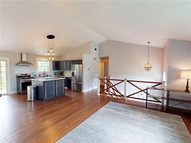 109 Remil Dr, Twp Of But Se, PA 16001 - kitchen featuring appliances with stainless steel finishes, wall chimney range hood, dark wood-style flooring, a chandelier, and lofted ceiling