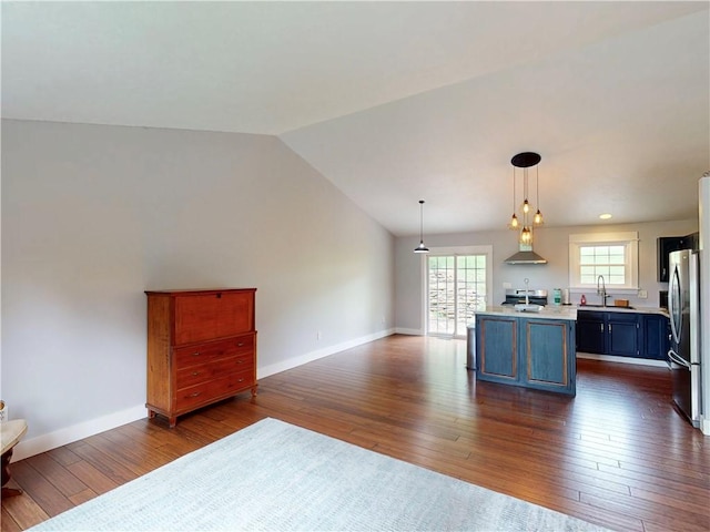 109 Remil Dr, Twp Of But Se, PA 16001 - kitchen with freestanding refrigerator, light countertops, dark wood-type flooring, open floor plan, and a kitchen island