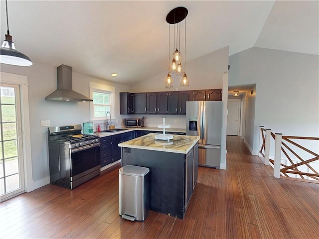 109 Remil Dr, Twp Of But Se, PA 16001 - kitchen with appliances with stainless steel finishes, wall chimney exhaust hood, light countertops, vaulted ceiling, and dark wood-style flooring