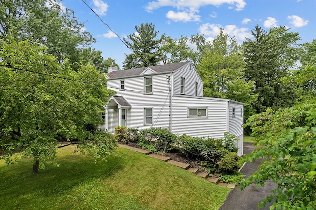 221 Springer, Moon/Crescent Twp, PA 15108 - view of front of home with a chimney, a front yard, and roof with shingles