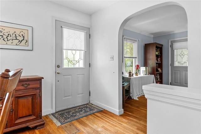 221 Springer, Moon/Crescent Twp, PA 15108 - foyer entrance featuring arched walkways, light wood-type flooring, and ornamental molding