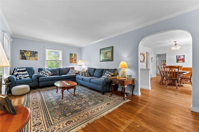 221 Springer, Moon/Crescent Twp, PA 15108 - living room with arched walkways, wood finished floors, crown molding, and a chandelier