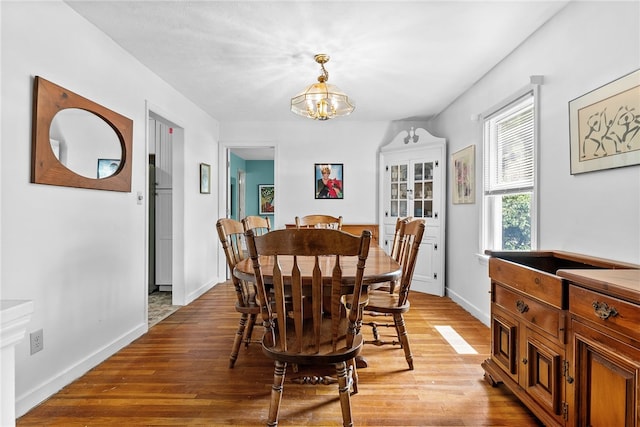 221 Springer, Moon/Crescent Twp, PA 15108 - dining room with light wood-style flooring and a chandelier