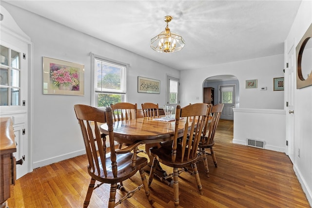 221 Springer, Moon/Crescent Twp, PA 15108 - dining area with arched walkways, hardwood / wood-style floors, and a chandelier