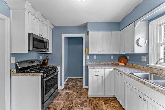 221 Springer, Moon/Crescent Twp, PA 15108 - kitchen featuring appliances with stainless steel finishes, white cabinetry, and light countertops