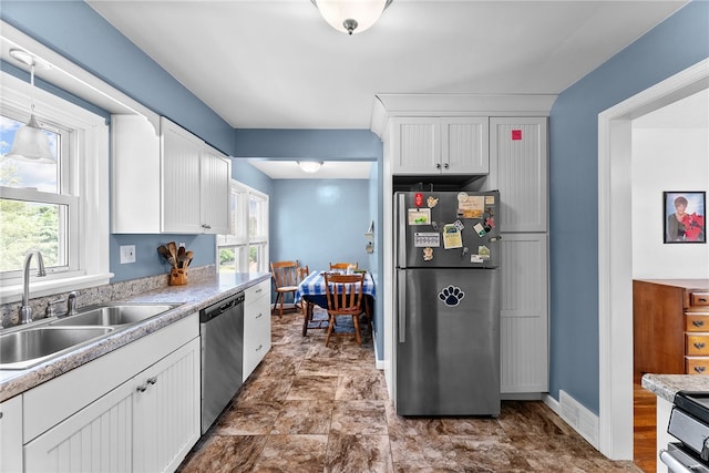 221 Springer, Moon/Crescent Twp, PA 15108 - kitchen with appliances with stainless steel finishes, plenty of natural light, and white cabinetry