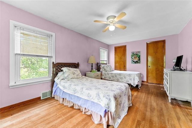 221 Springer, Moon/Crescent Twp, PA 15108 - bedroom with multiple windows, wood finished floors, and ceiling fan
