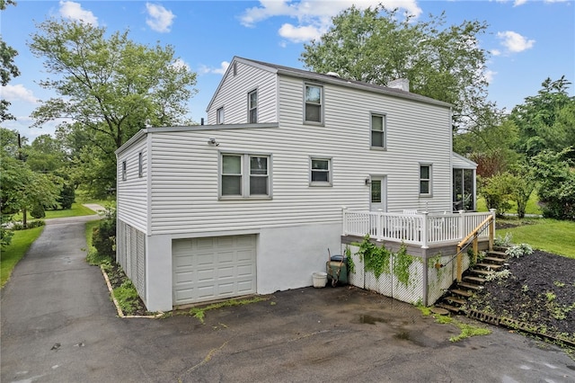 221 Springer, Moon/Crescent Twp, PA 15108 - view of property exterior with a deck, a chimney, asphalt driveway, stairs, and an attached garage