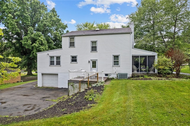 221 Springer, Moon/Crescent Twp, PA 15108 - rear view of house with a sunroom, driveway, a yard, and an attached garage