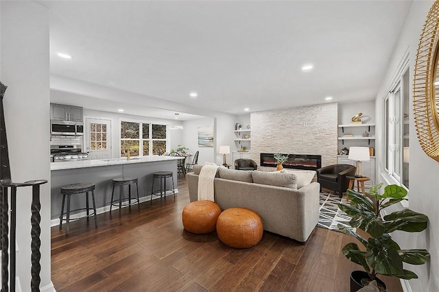 1171 Arrowood Dr, Mt Lebanon, PA 15243 - living room with recessed lighting, dark wood-style flooring, and a stone fireplace
