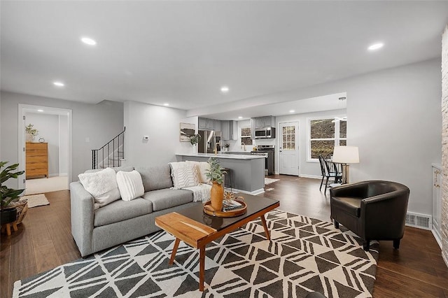 1171 Arrowood Dr, Mt Lebanon, PA 15243 - living area featuring dark wood finished floors, recessed lighting, and stairs