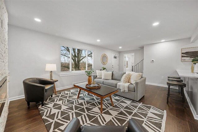 1171 Arrowood Dr, Mt Lebanon, PA 15243 - living room featuring wood finished floors, stairway, recessed lighting, and a stone fireplace