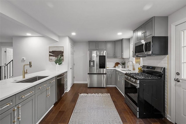 1171 Arrowood Dr, Mt Lebanon, PA 15243 - kitchen featuring stainless steel appliances, gray cabinetry, tasteful backsplash, dark wood-type flooring, and recessed lighting