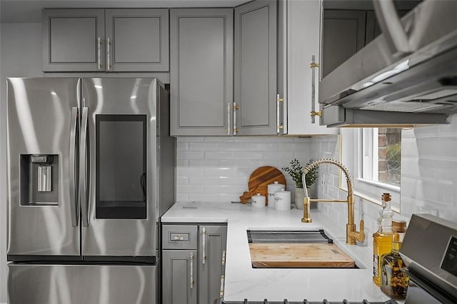 1171 Arrowood Dr, Mt Lebanon, PA 15243 - kitchen with stainless steel fridge with ice dispenser, gray cabinets, and backsplash