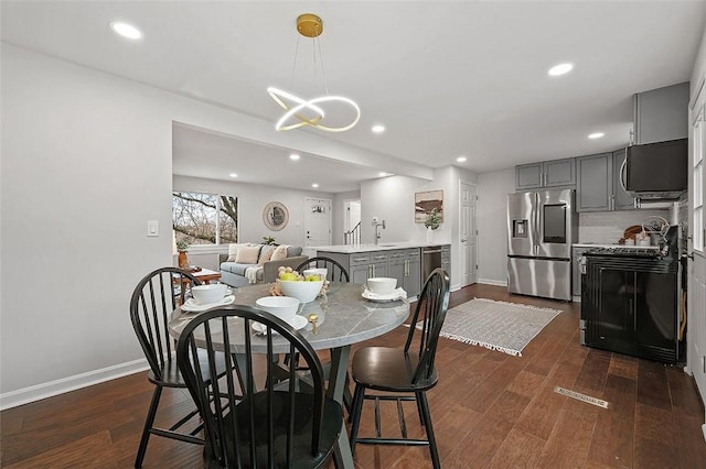 1171 Arrowood Dr, Mt Lebanon, PA 15243 - dining area featuring dark wood finished floors, a chandelier, and recessed lighting