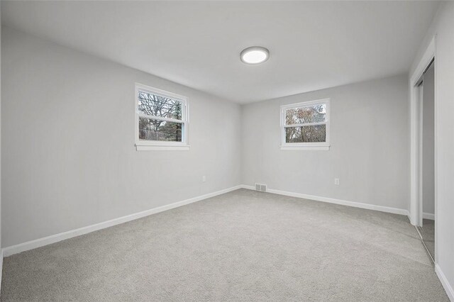 1171 Arrowood Dr, Mt Lebanon, PA 15243 - unfurnished bedroom featuring a closet, multiple windows, and carpet flooring