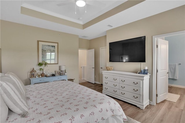 2005 Lampl Ln, Penn Twp Wml, PA 15644 - bedroom featuring a tray ceiling, light wood finished floors, ornamental molding, and a ceiling fan